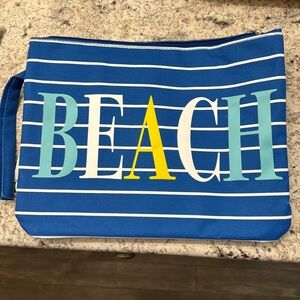 NWT “Beach” wet/dry bag; outside pocket; inside lined; blue with white stripes